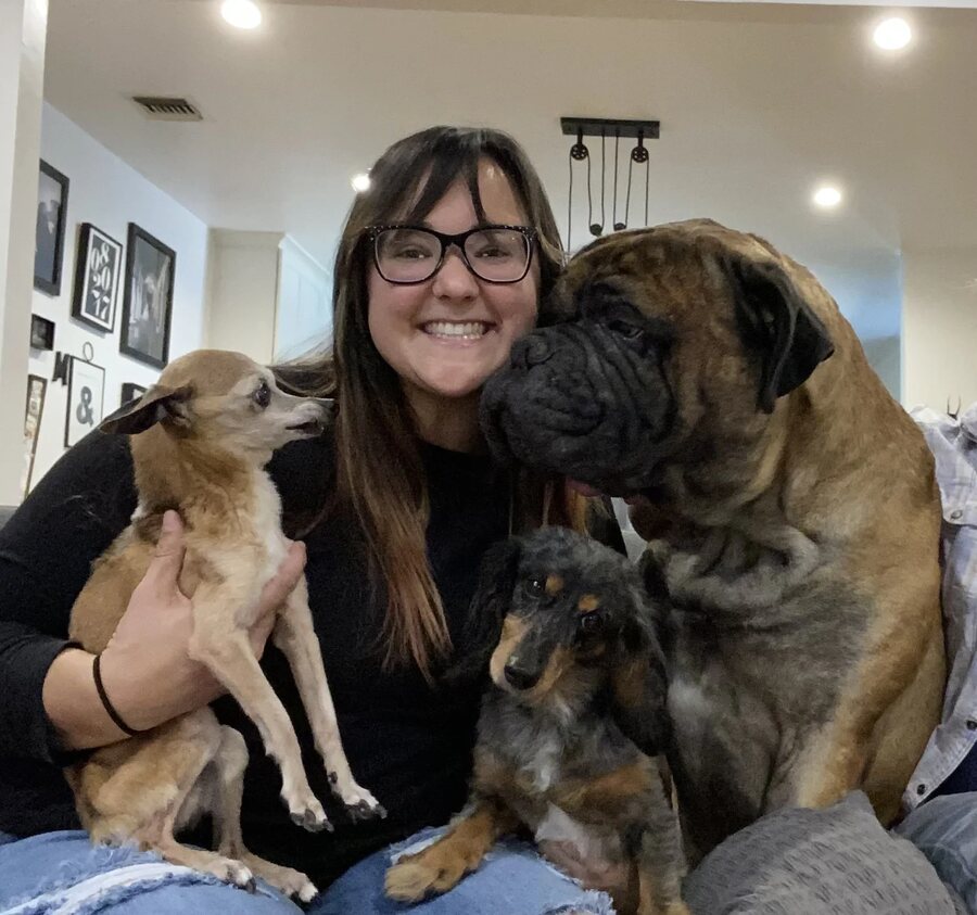 Dr. Mishka Williams with her rescue dogs